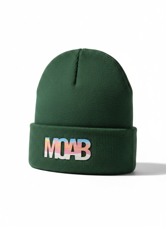 Moove Headwear dark green acrylic rib-knit beanie with a woven patch featuring the word MOAB in pastel sunset colors.