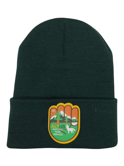 Moove Headwear dark green cuffed knit beanie with an AltUs National Park Service patch for winter hiking