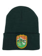 Moove Headwear dark green cuffed knit beanie with an AltUs National Park Service patch for winter hiking