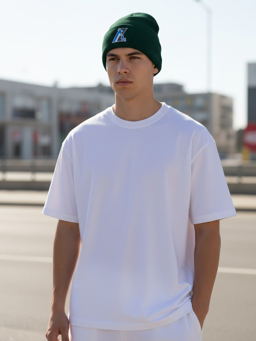 Moove Headwear Arizona AZ green rib-knit beanie with a front woven patch worn by a man in a white t-shirt
