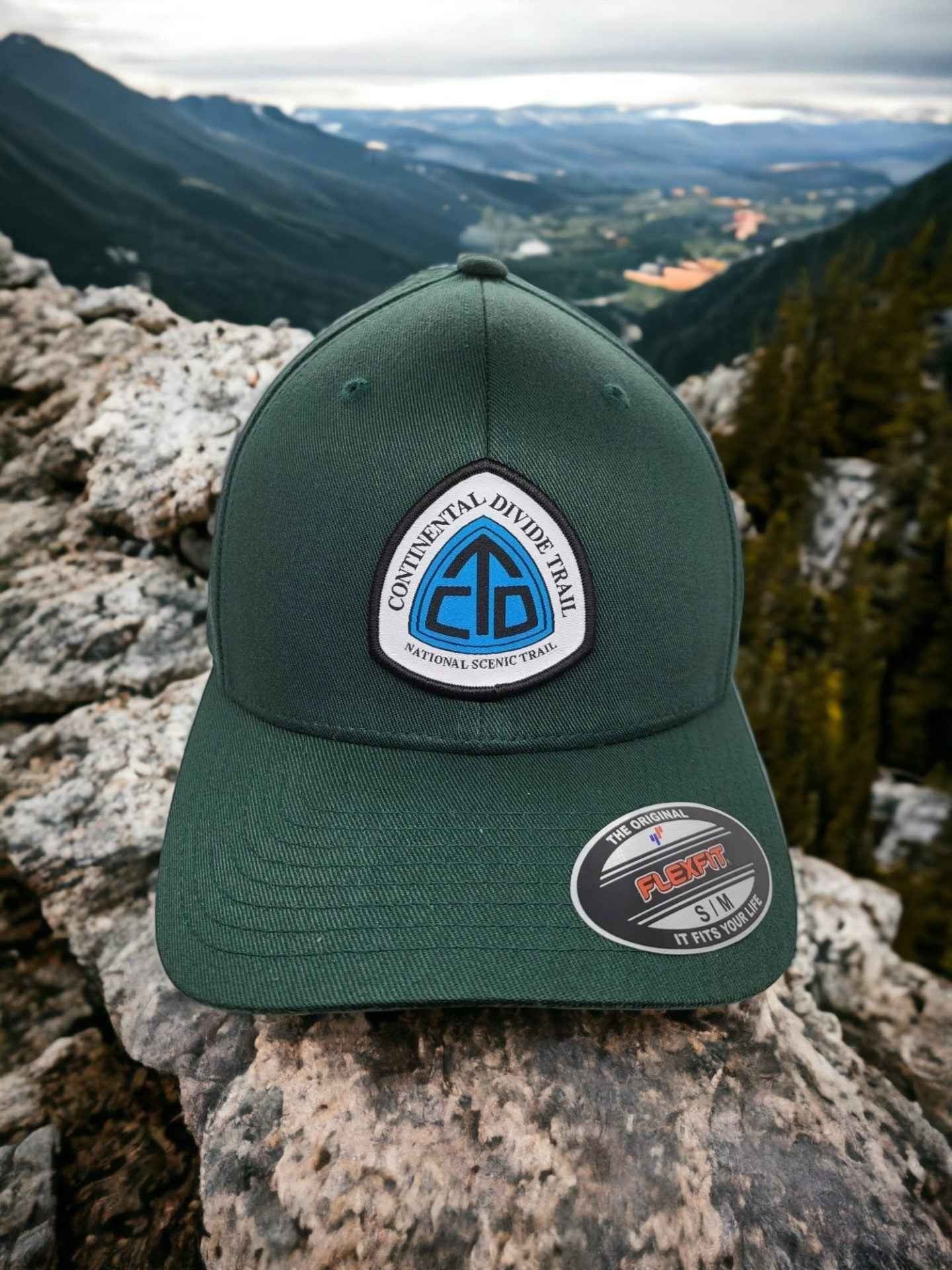 Moove Headwear dark green trucker hat with Continental Divide Trail patch, adjustable fit, perfect for hiking.