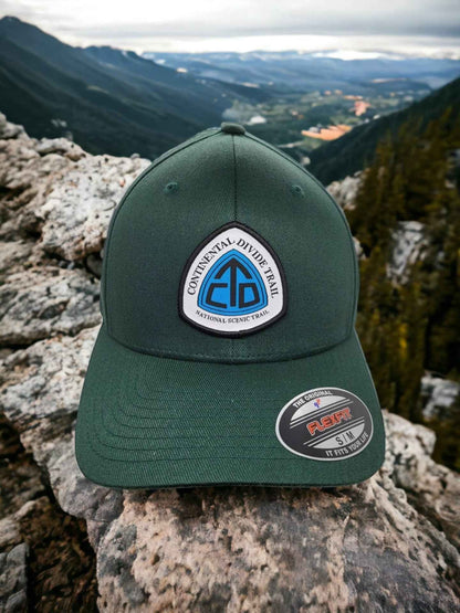 Moove Headwear dark green trucker hat with Continental Divide Trail patch, adjustable fit, perfect for hiking.