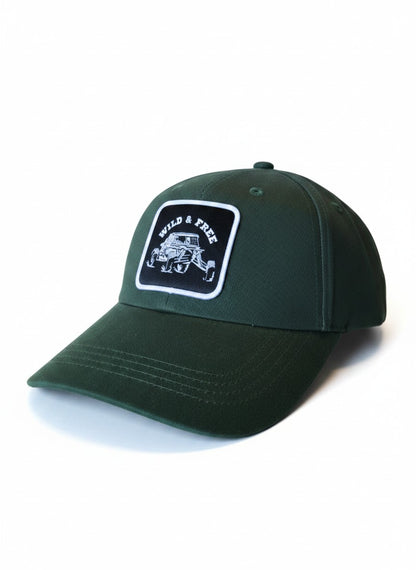 Moove Headwear dark green cotton dad hat with a woven patch featuring a UTV and the text "WILD & FREE".