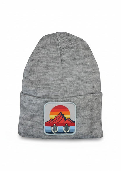 Moove Headwear grey knit beanie featuring a desert sunset and cactus patch on the front cuff.
