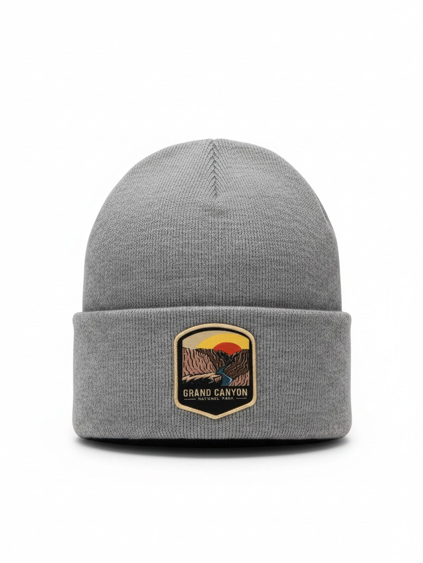 Moove Headwear grey knit beanie featuring a Grand Canyon National Park patch with a sunset landscape design.