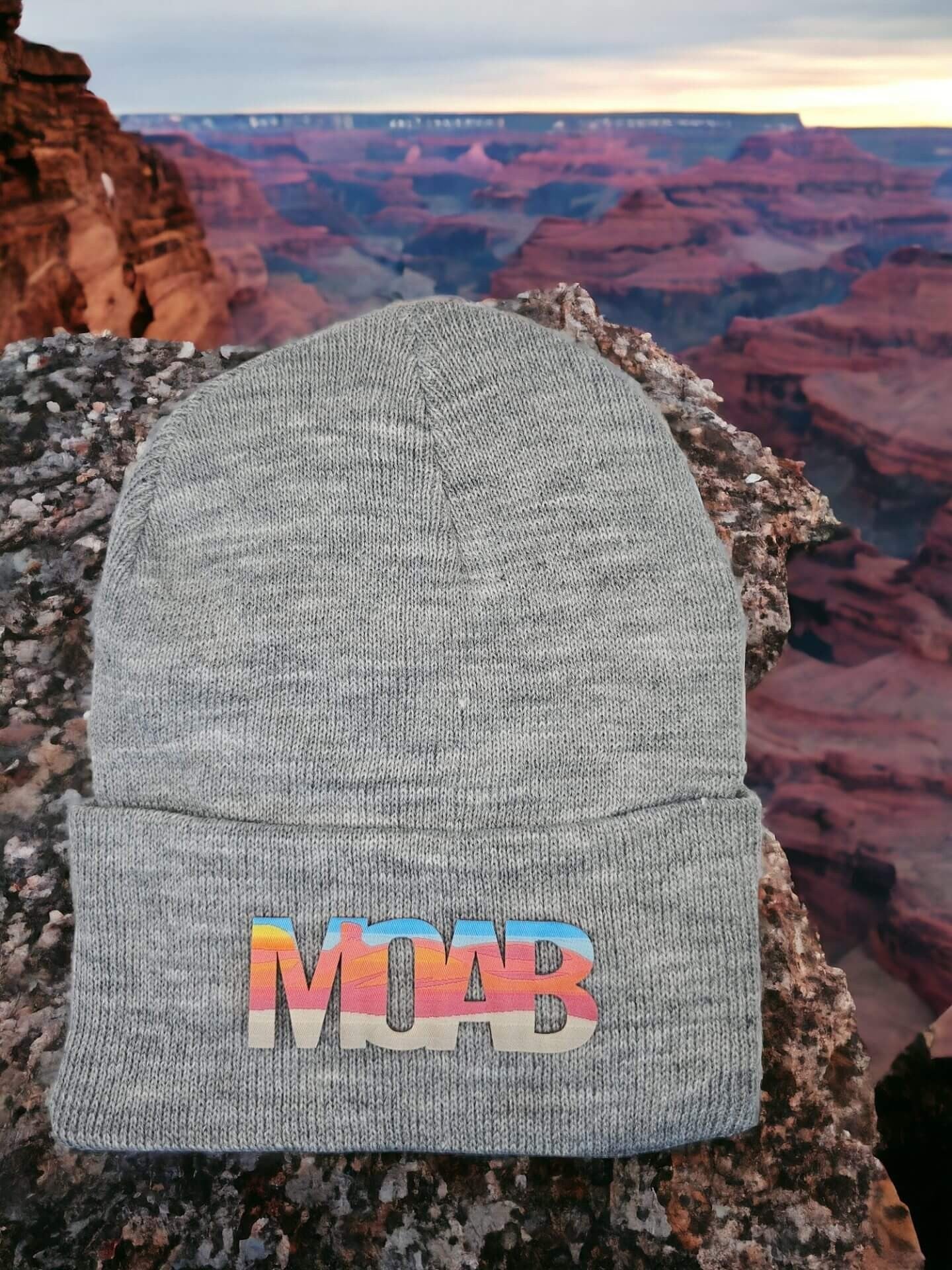 Moove Headwear grey acrylic rib-knit beanie with colorful "MOAB" patch. Ideal for outdoor adventures.