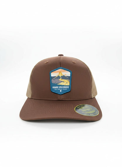 Moove Headwear brown trucker hat with Hawaii Volcanoes National Park logo patch and tan mesh back. Adjustable strap.