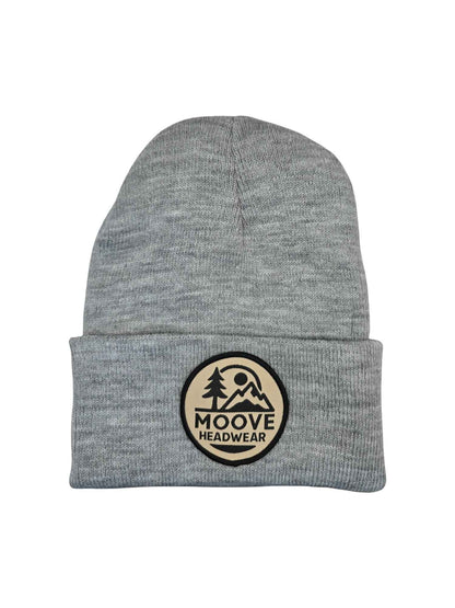 Moove Headwear heather gray knit beanie with fold-over cuff and circular mountain logo patch.