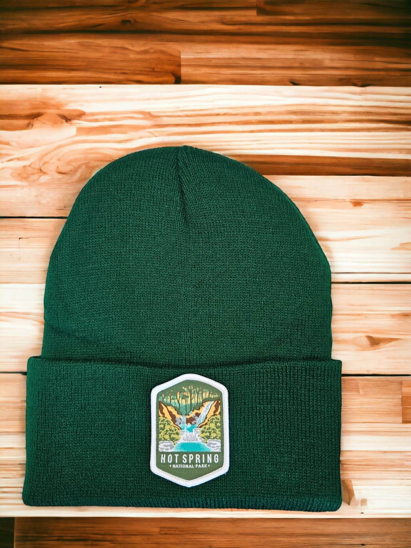 Moove Headwear dark green acrylic rib-knit beanie with Hot Springs National Park embroidered patch.