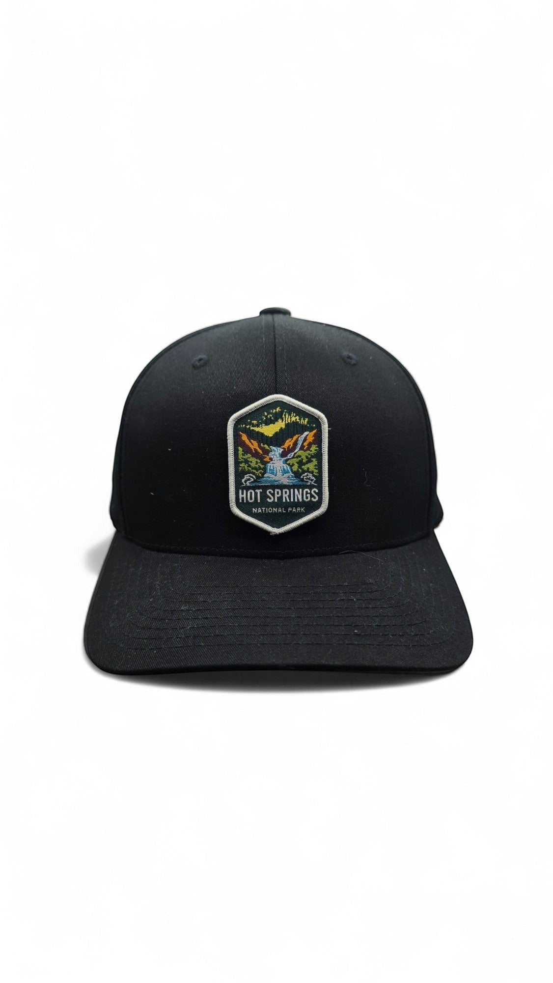 Moove Headwear black fitted baseball cap with Hot Springs National Park embroidered patch featuring a waterfall and trees.