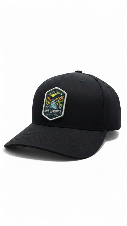 Moove Headwear black fitted baseball cap with embroidered Hot Springs National Park patch featuring a waterfall and mountains.