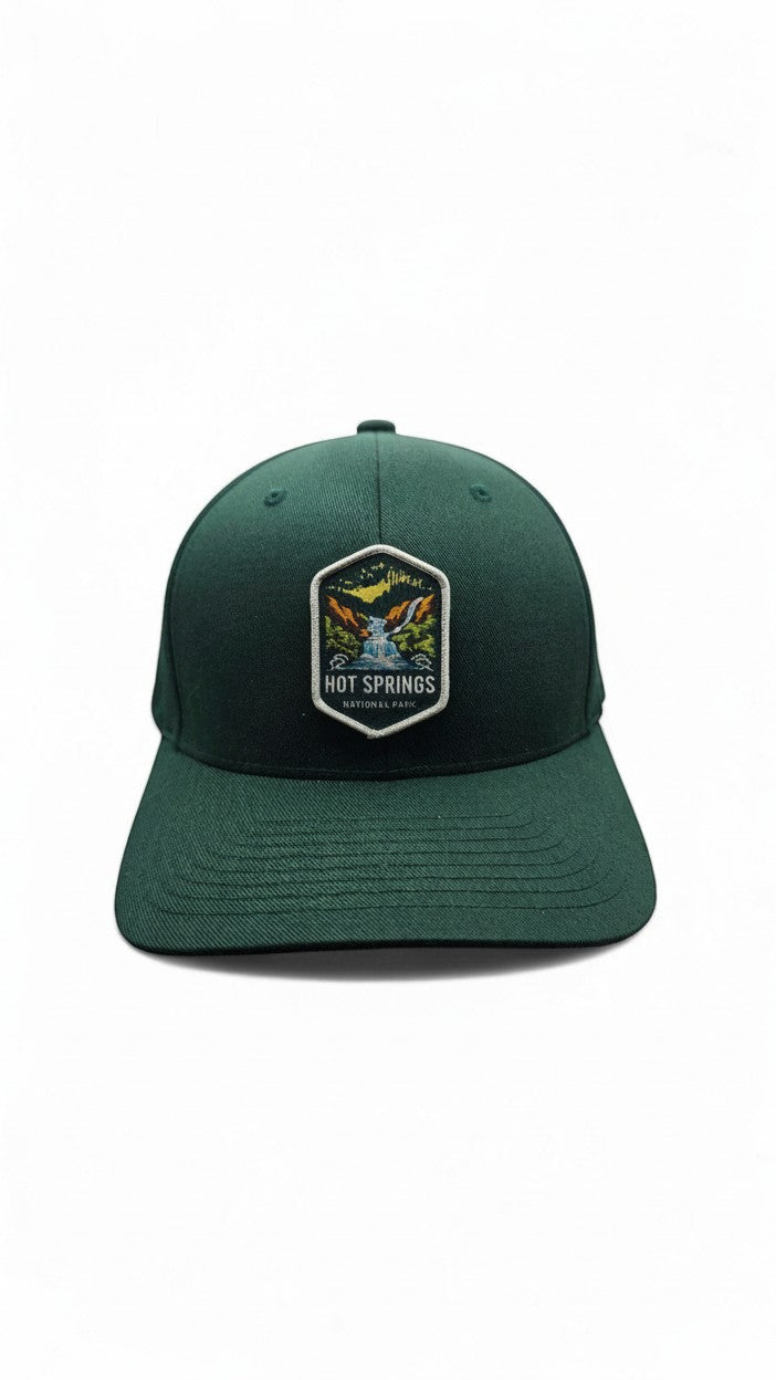 Moove Headwear dark green fitted baseball cap with embroidered Hot Springs National Park patch.