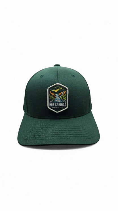 Moove Headwear dark green fitted baseball cap with embroidered Hot Springs National Park patch.