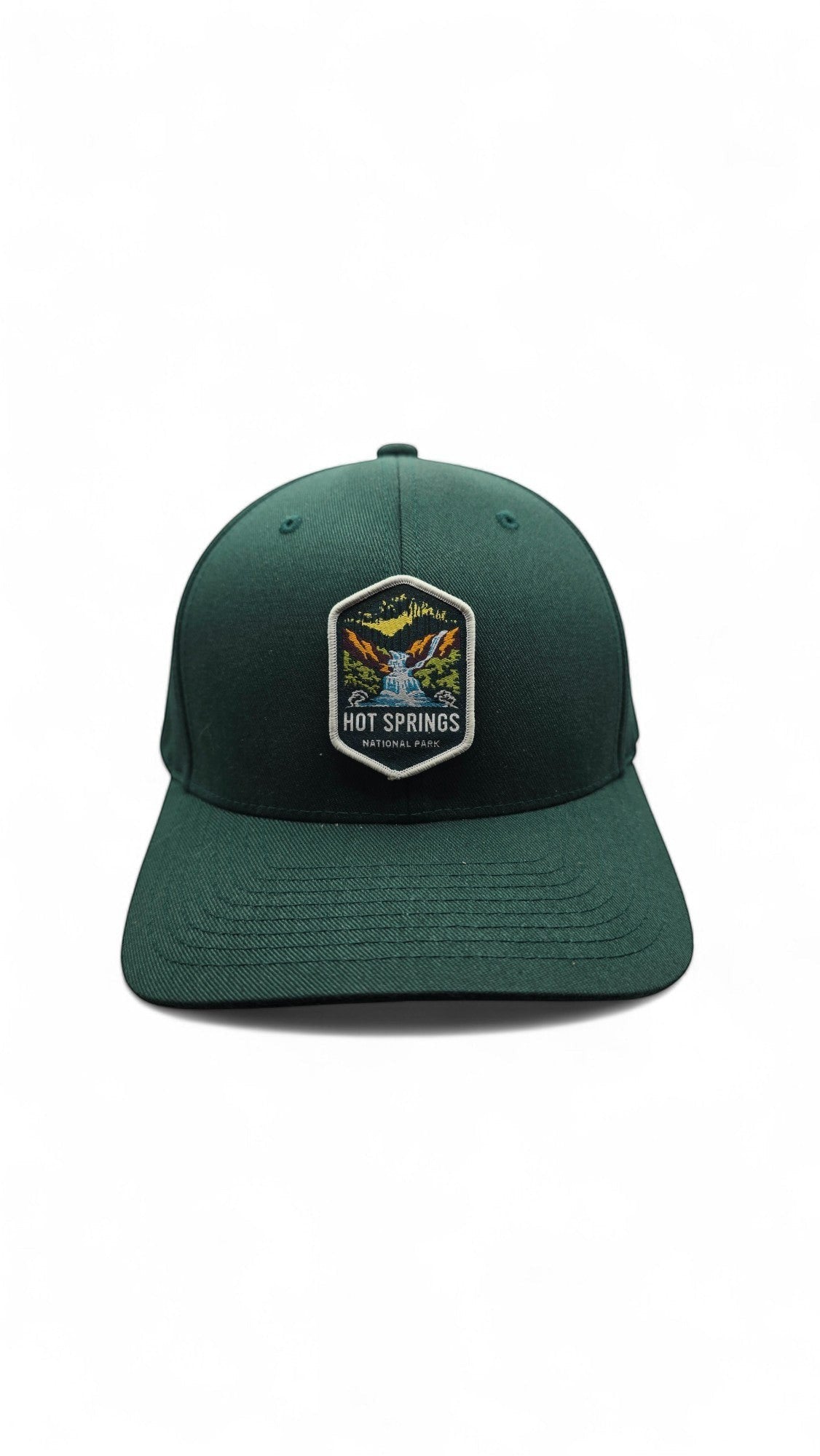 Moove Headwear dark green fitted baseball cap with embroidered Hot Springs National Park patch.