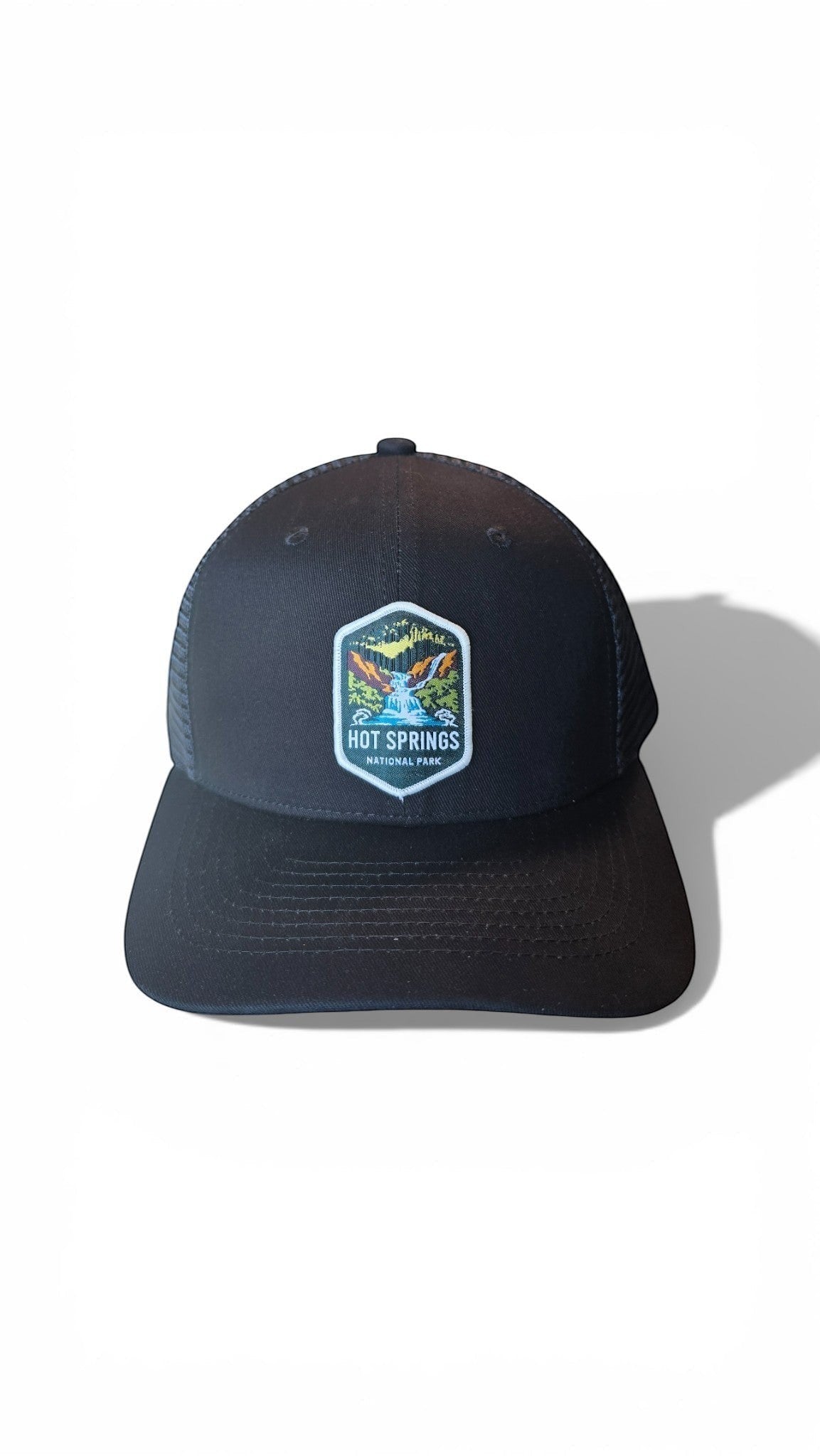 Moove Headwear black trucker hat with mesh back and Hot Springs National Park patch