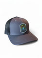Moove Headwear grey trucker hat with black mesh back and Hot Springs National Park embroidered patch.