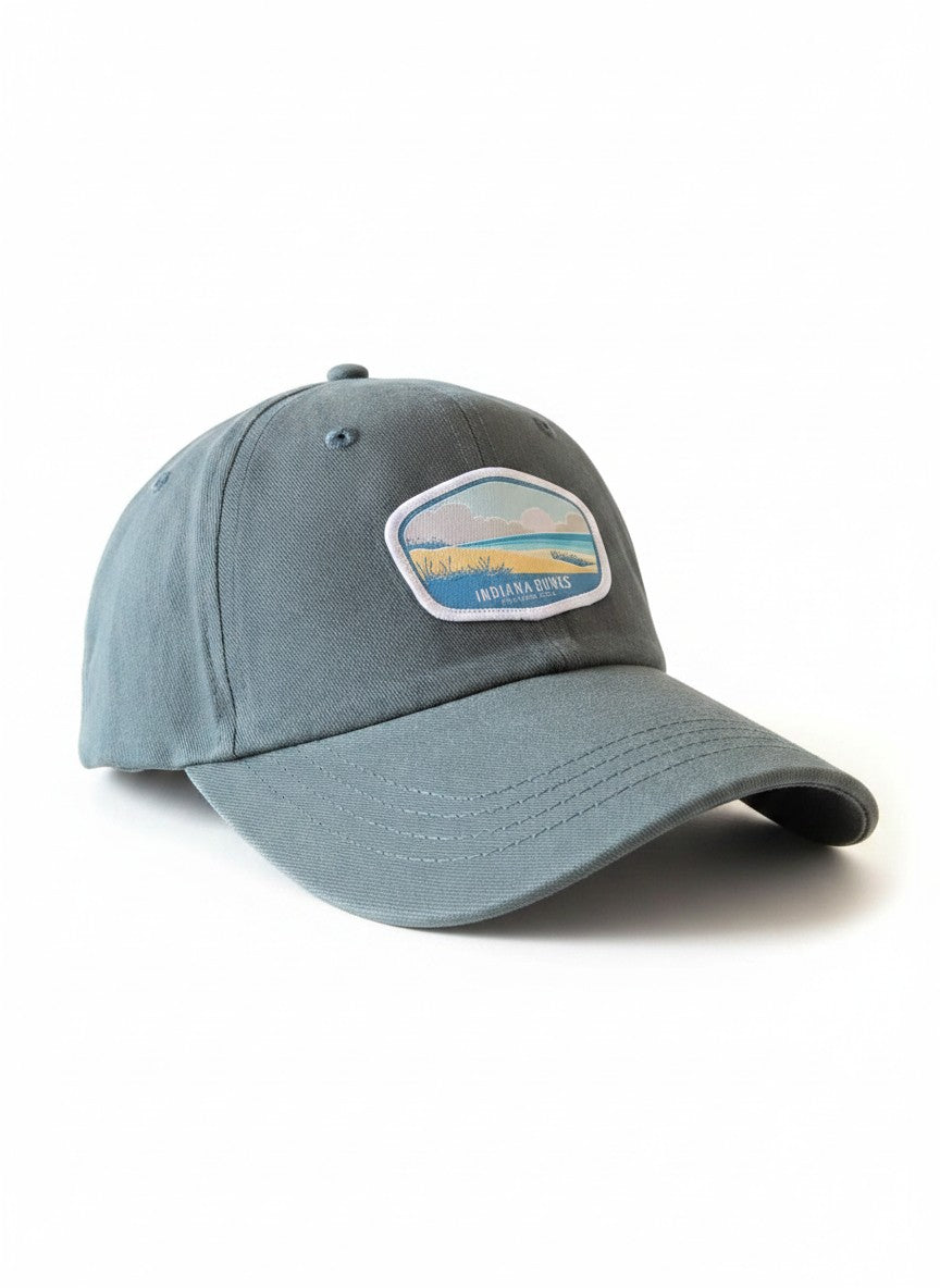 Moove Headwear grey adjustable baseball cap with embroidered Indiana Dunes logo patch, perfect for outdoor adventures.