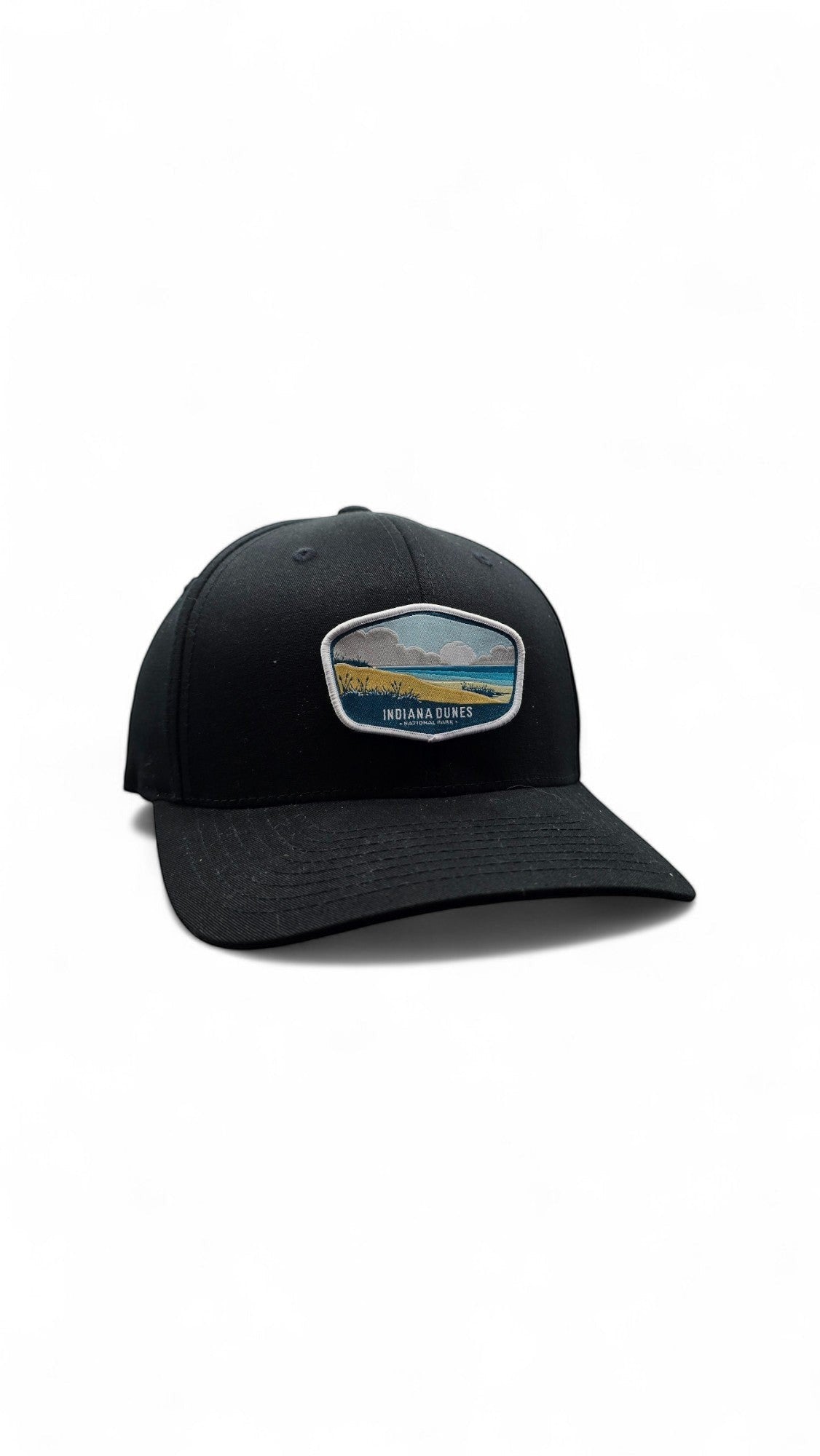 Moove Headwear black fitted cap with Indiana Dunes National Park embroidered patch, adjustable strap, and breathable design.