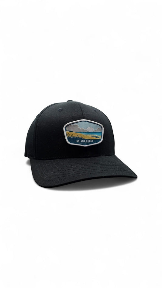 Moove Headwear black fitted cap with Indiana Dunes National Park embroidered patch, adjustable strap, and breathable design.