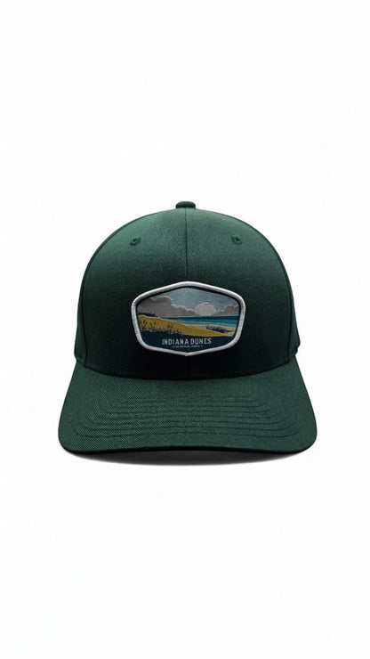 Moove Headwear dark green cotton blend baseball cap with Indiana Dunes National Park embroidered patch and adjustable strap.