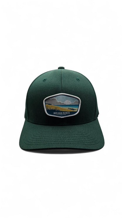 Moove Headwear dark green cotton blend baseball cap with Indiana Dunes National Park embroidered patch and adjustable strap.