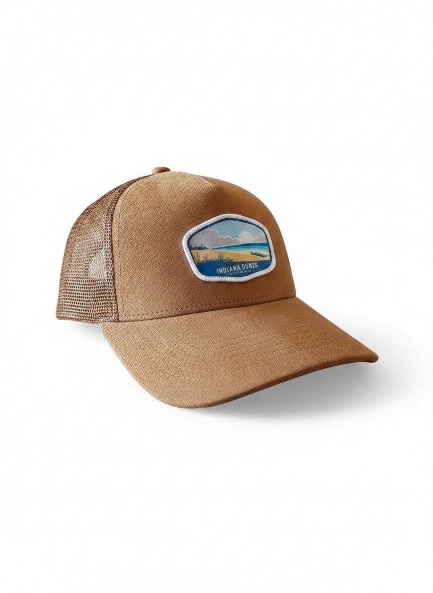 Moove Headwear brown suede trucker hat with mesh back and Indiana Dunes patch. Adjustable snap closure.