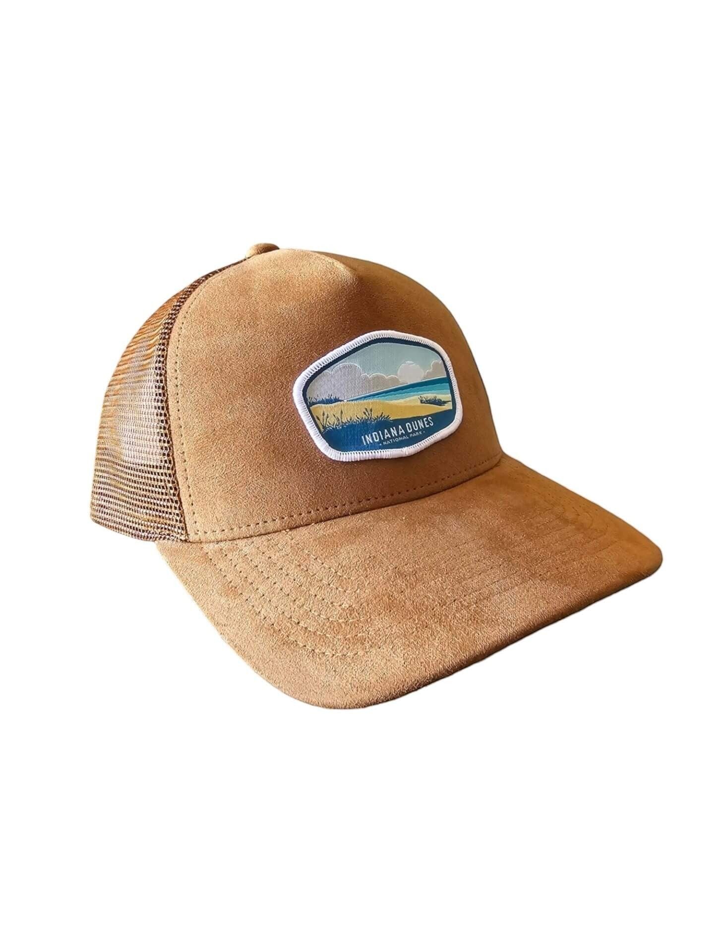Moove Headwear tan suede trucker hat with mesh back and Indiana Dunes National Park patch.