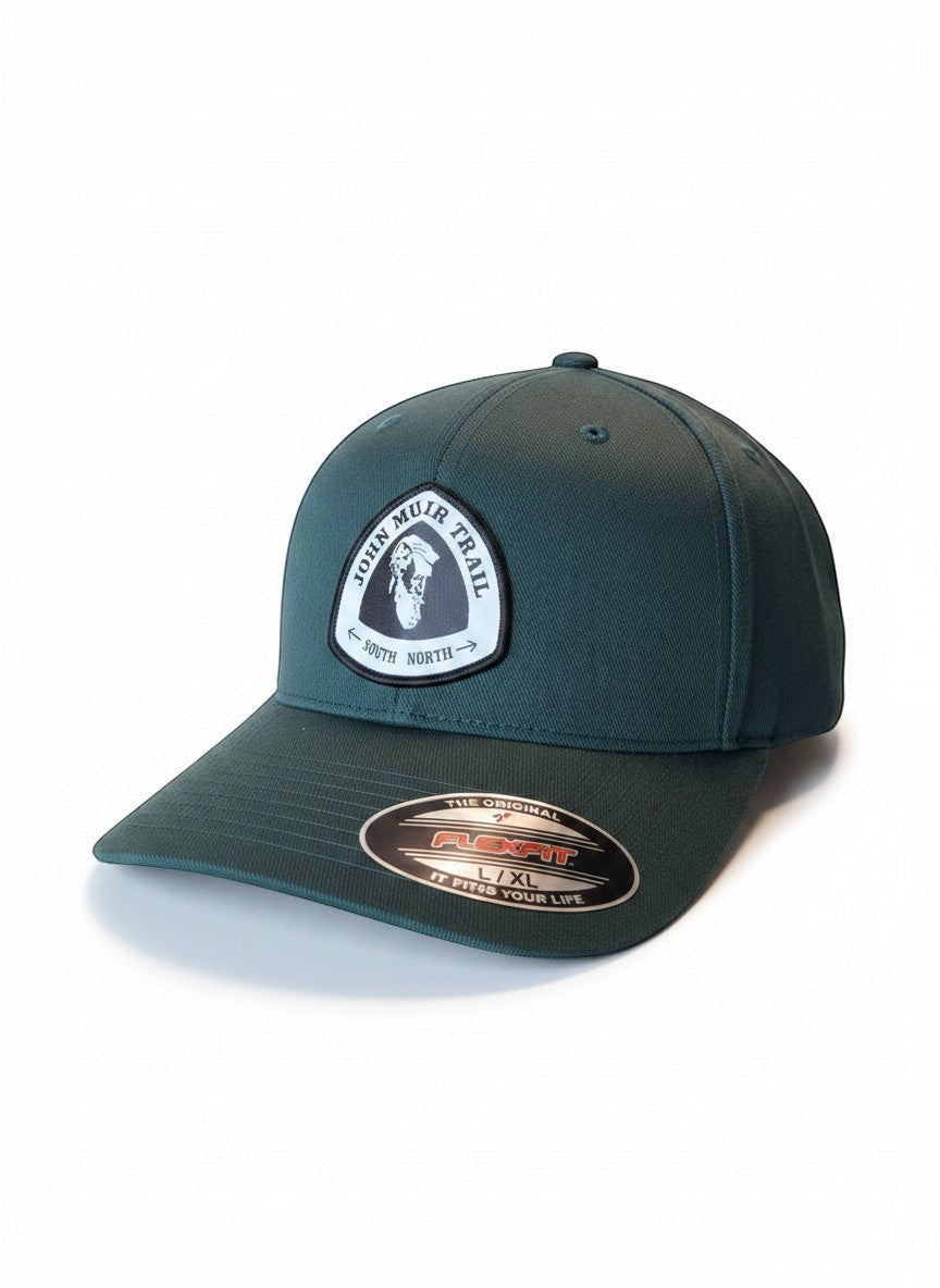 Moove Headwear dark green baseball cap with embroidered John Muir Trail patch and Flexfit label.