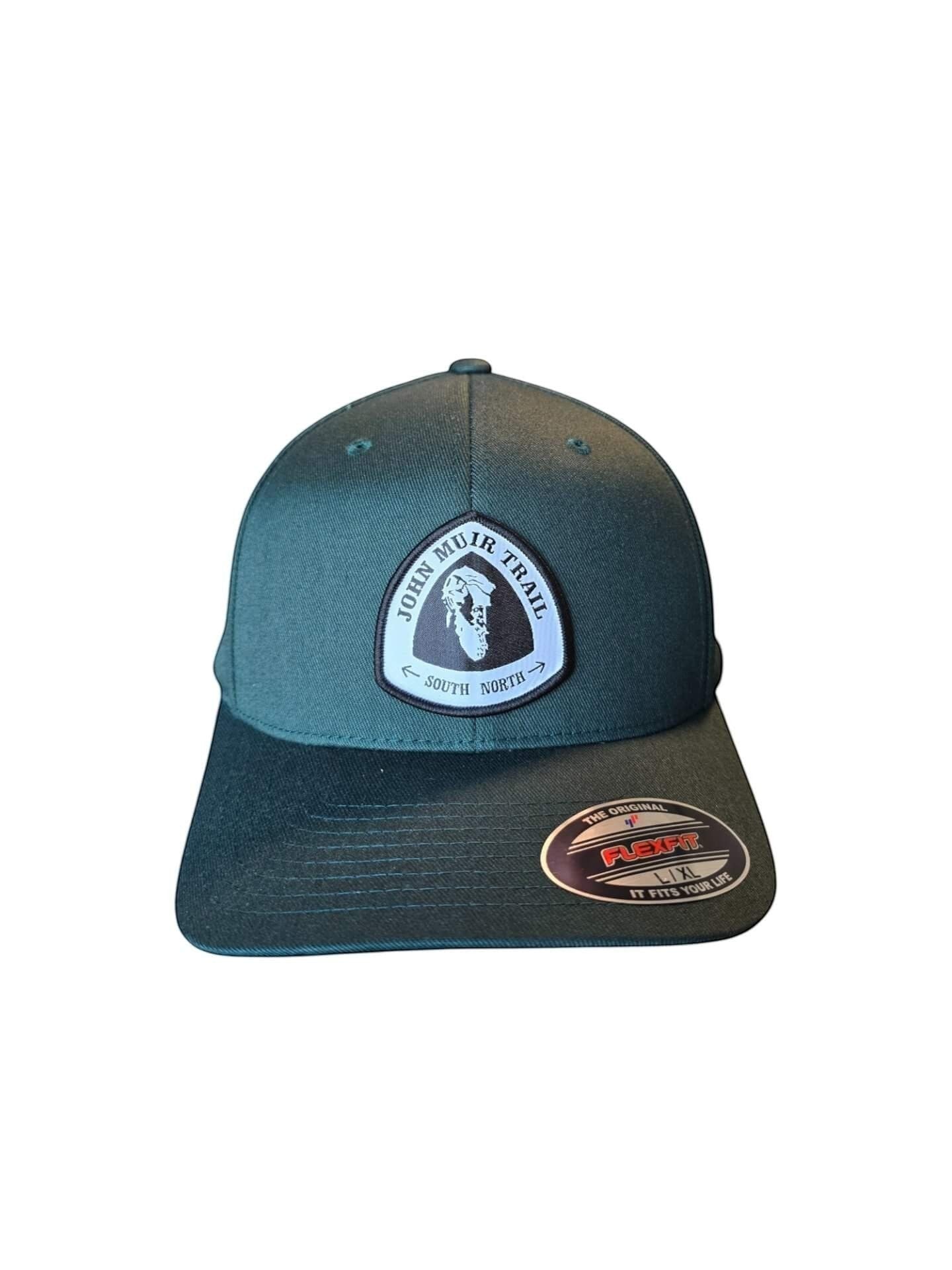 Moove Headwear dark green baseball cap with embroidered John Muir Trail patch and Flexfit logo.