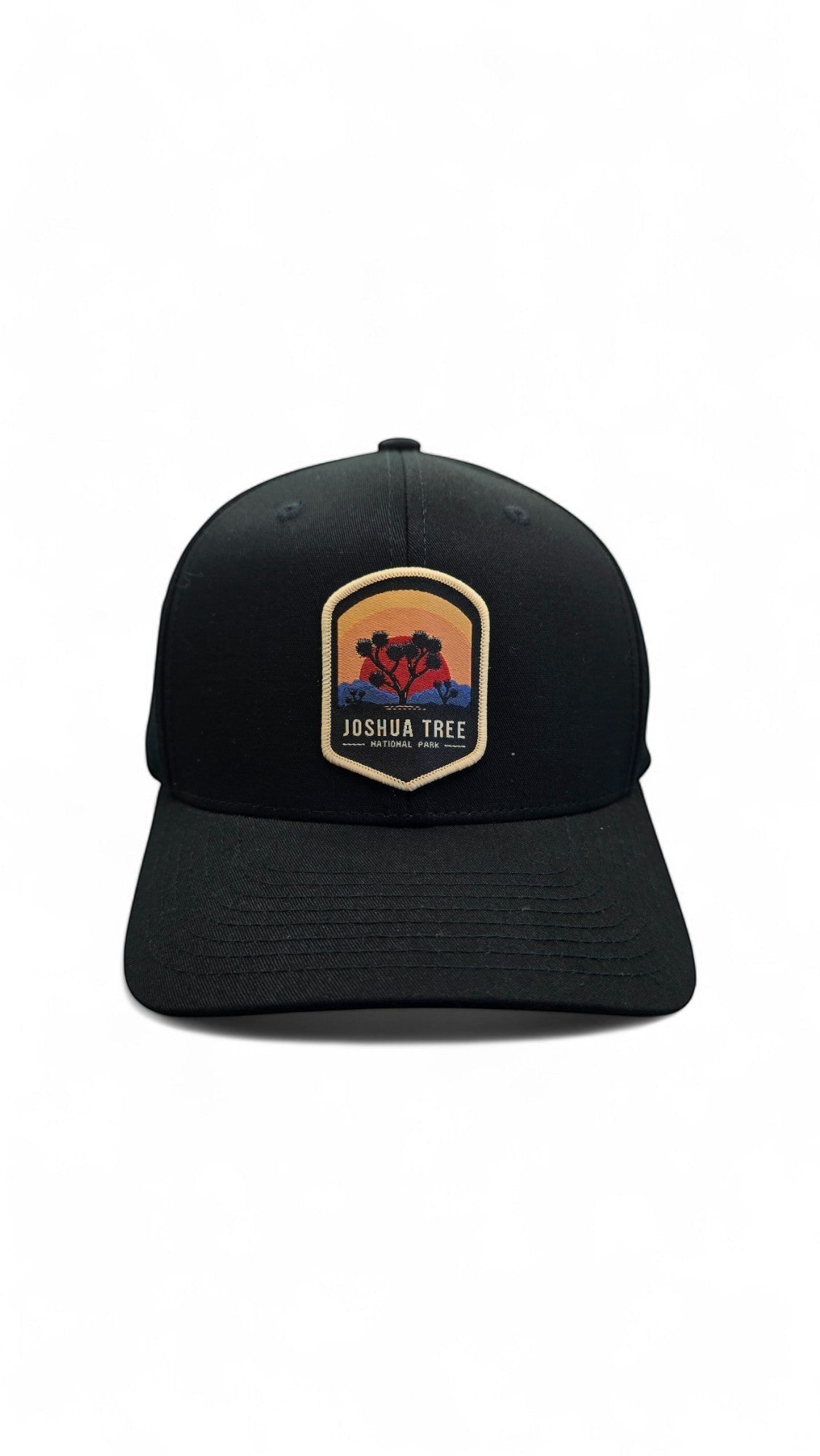 Moove Headwear black Flexfit cap with embroidered Joshua Tree National Park sunset patch. Hiking gear.