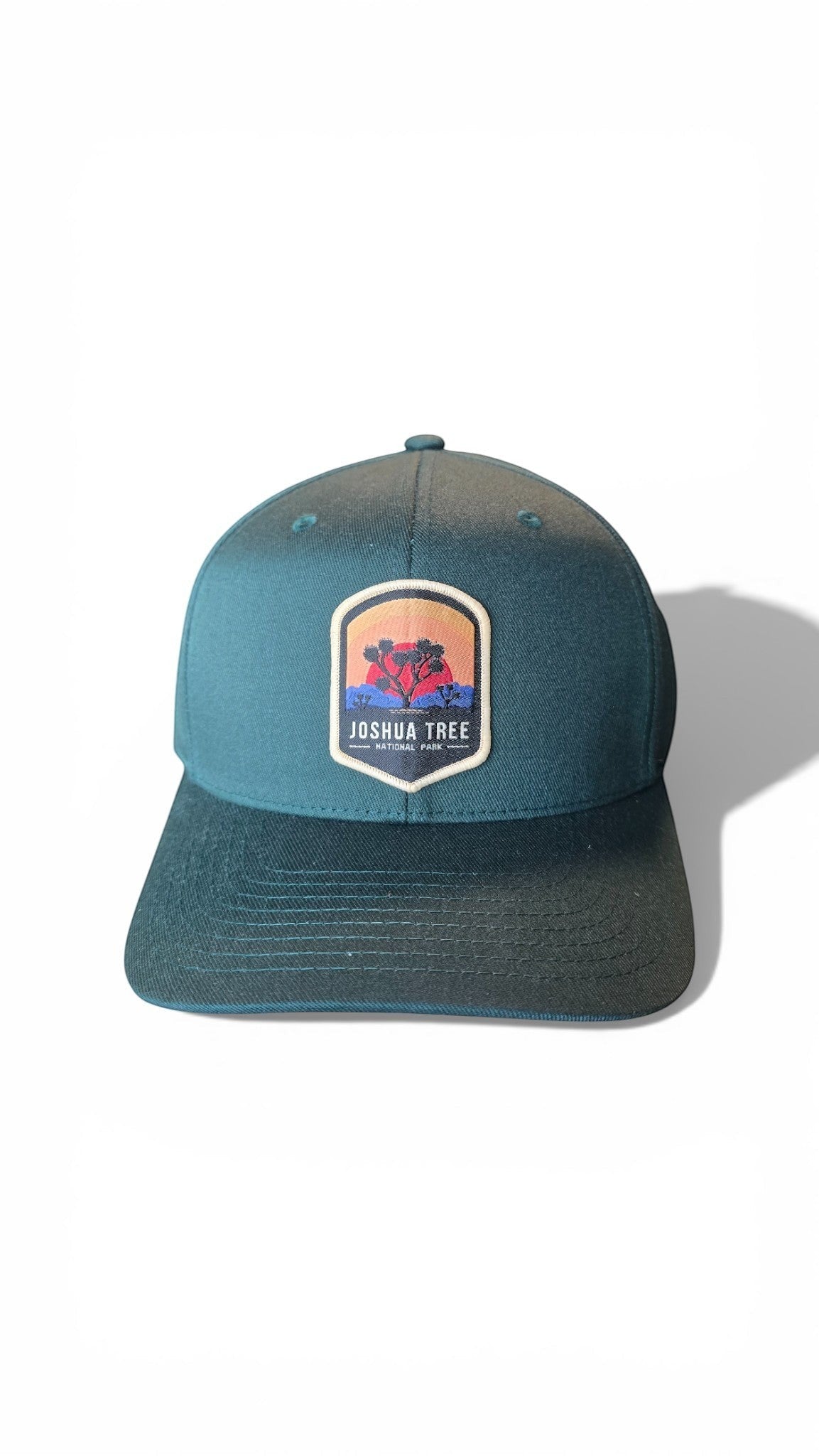 Moove Headwear dark teal Flexfit cap with Joshua Tree National Park embroidered patch. Designed for hiking and outdoor adventures.