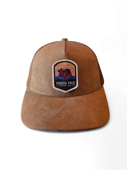 Moove Headwear brown suede trucker hat with Joshua Tree National Park graphic patch and mesh back.