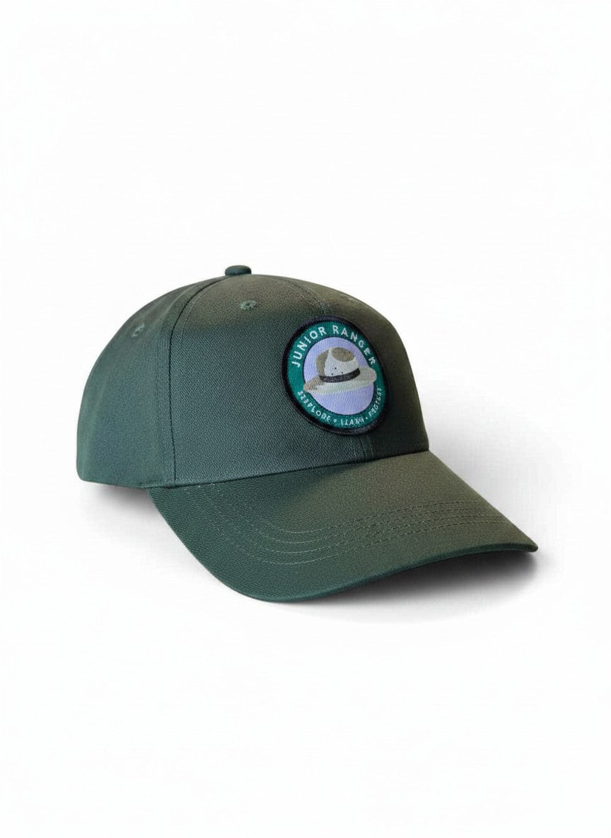 Moove Headwear Junior Park Ranger hat for kids, dark green fabric with a circular patch featuring a ranger hat and "Explore Learn Protect" text.