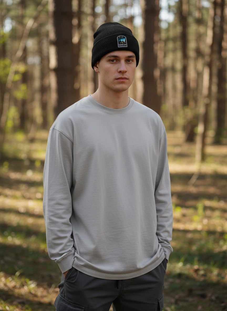 Moove Headwear black acrylic rib-knit beanie with Mammoth Cave National Park patch worn by a man in a forest