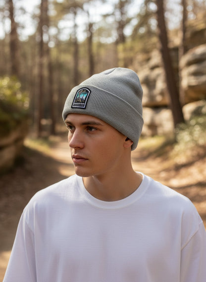 Moove Headwear grey rib-knit beanie with a Mammoth Cave National Park patch worn by a man in a forest setting.
