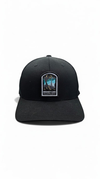 Moove Headwear black baseball cap with embroidered Mammoth Cave National Park patch featuring cave formations and text.