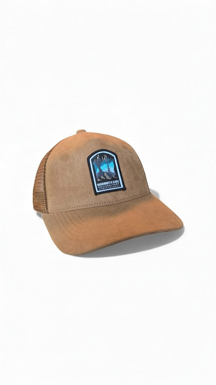 Moove Headwear tan suede trucker hat with mesh back and Mammoth Cave National Park patch. Adjustable snapback.