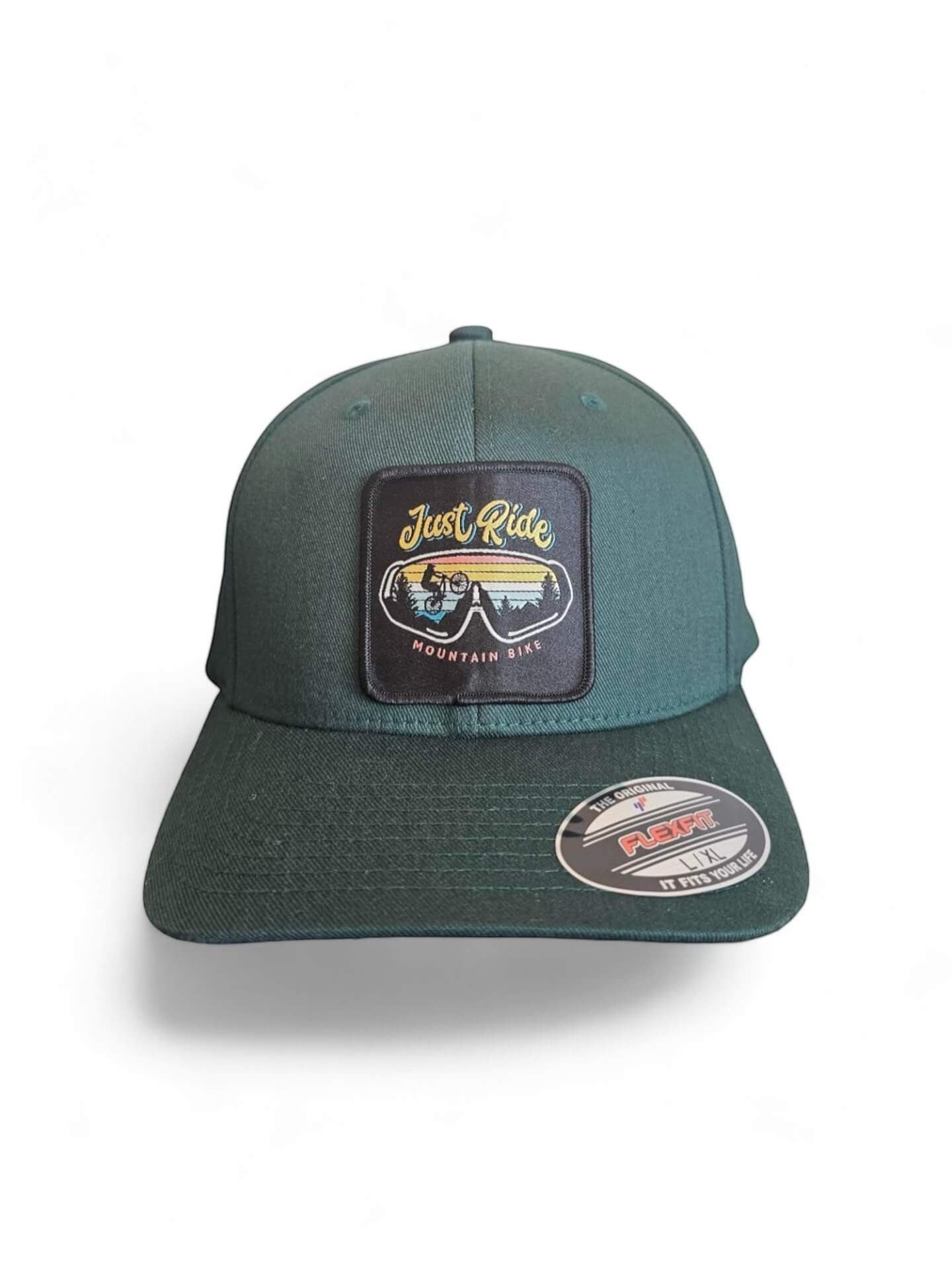 Moove Headwear dark green fitted baseball cap with "Just Ride Mountain Bike" patch featuring a cyclist and sunset.