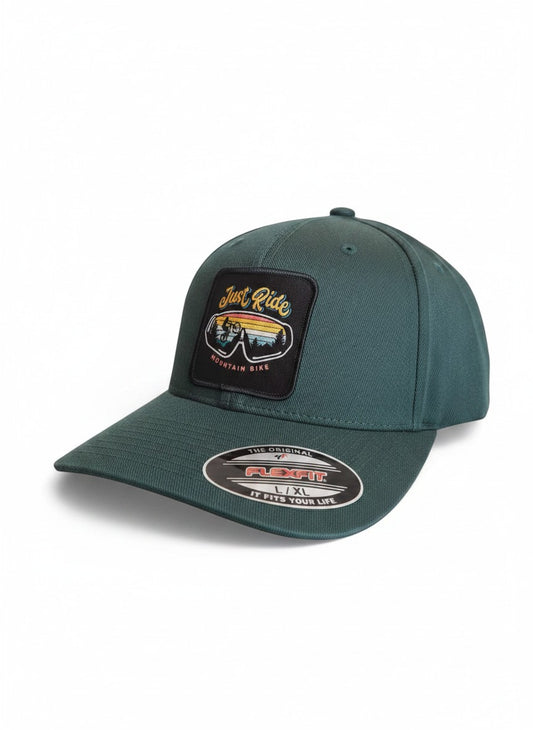Moove Headwear dark green fitted baseball cap with "Just Ride Mountain Bike" patch featuring a cyclist and sunset.