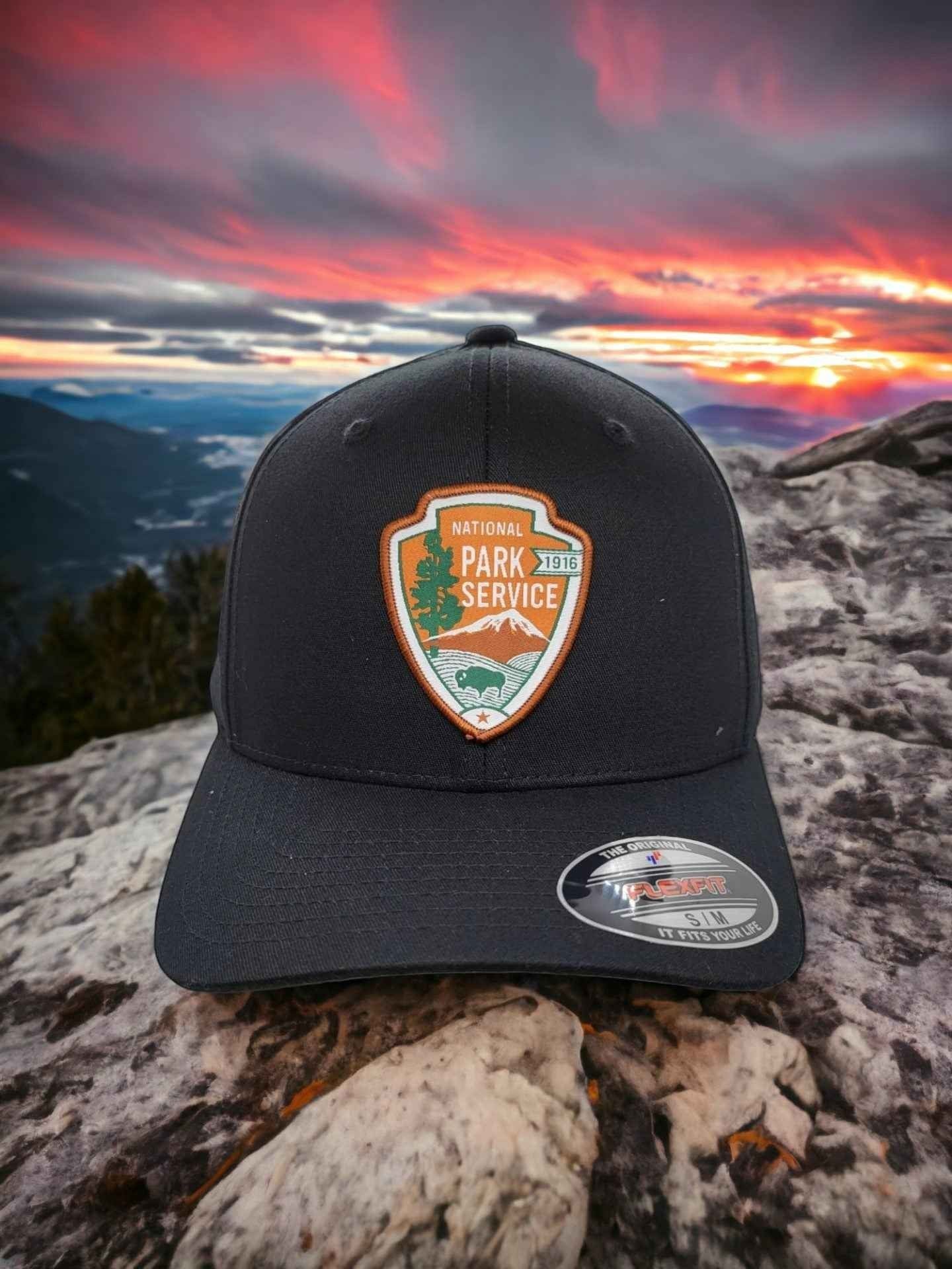 Moove Headwear black baseball cap with National Park Service patch, featuring a scenic landscape and bison graphic.