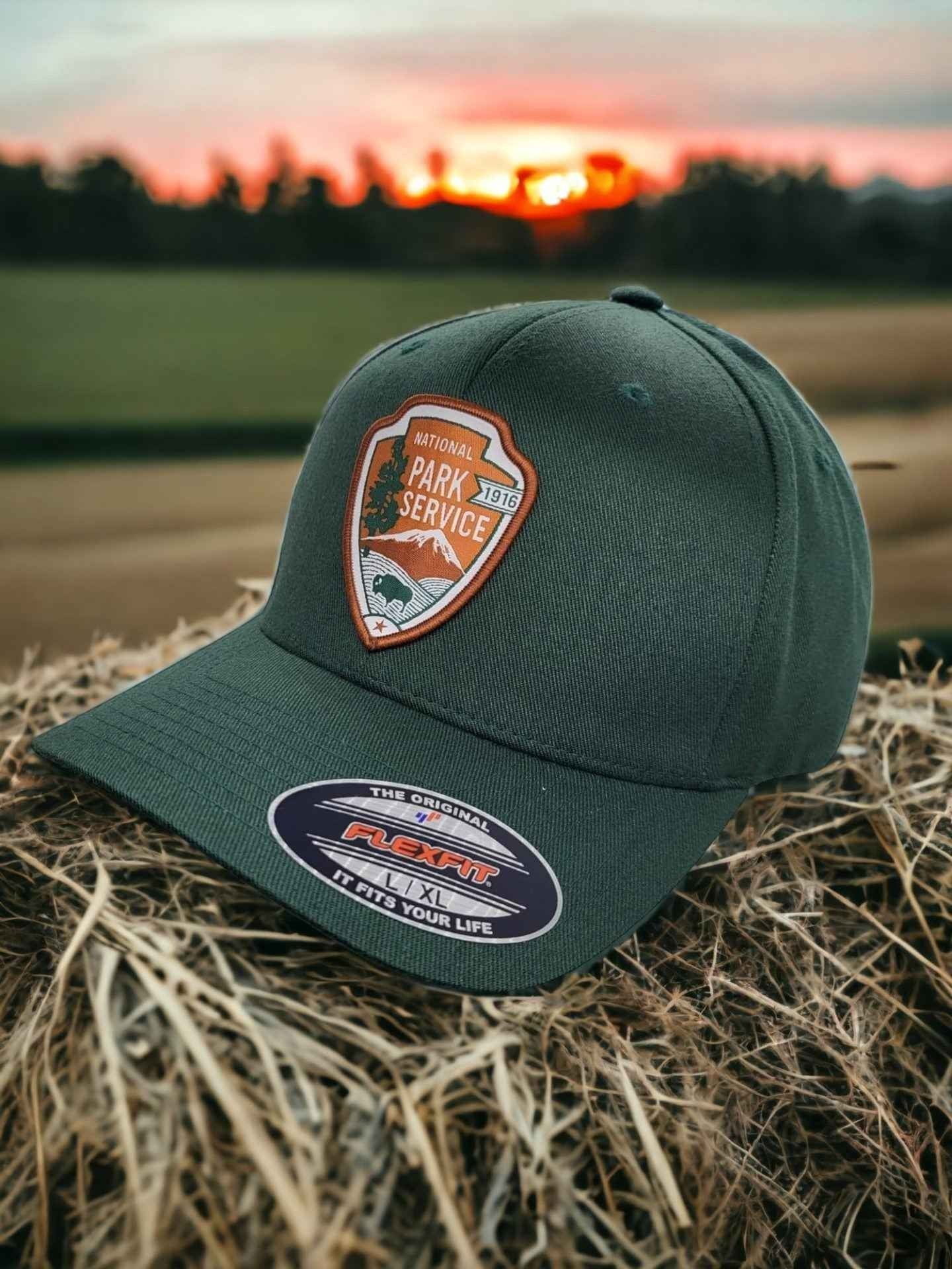 Moove Headwear dark green National Park Service Flexfit baseball cap with embroidered patch. Outdoor adventure style.