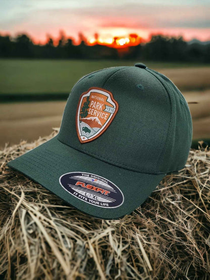 Moove Headwear dark green National Park Service Flexfit baseball cap with embroidered patch. Outdoor adventure style.