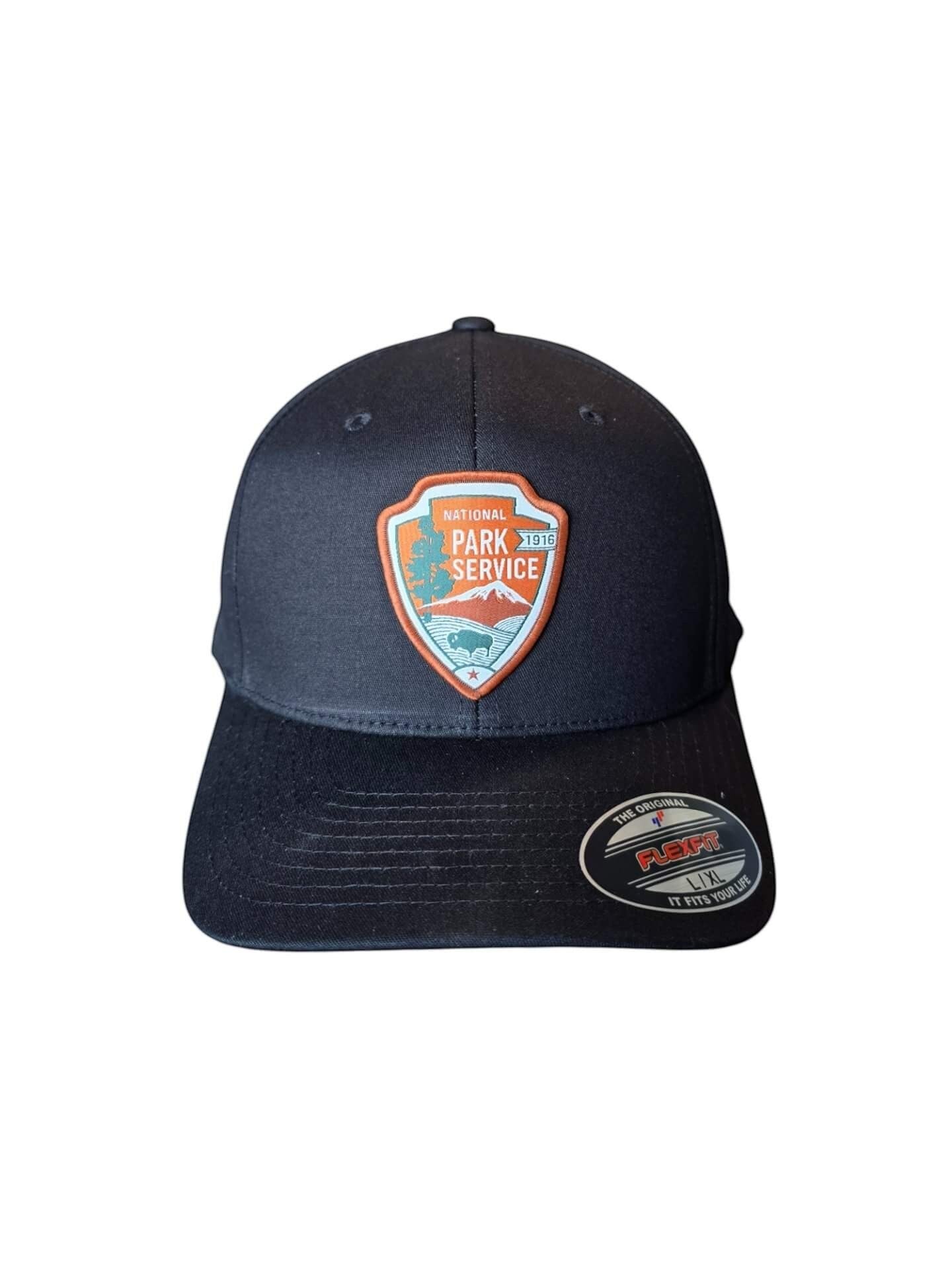 Moove Headwear black baseball cap with National Park Service logo patch and Flexfit label.
