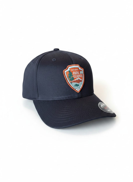 Moove Headwear black baseball cap with National Park Service patch and Flexfit logo