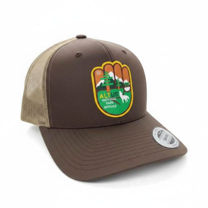 Moove Headwear brown trucker hat with National Park Service logo patch, mesh back, and snapback closure.