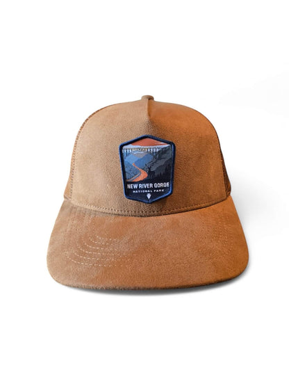 Moove Headwear New River Gorge National Park suede trucker hat with mesh back and adjustable snap closure.