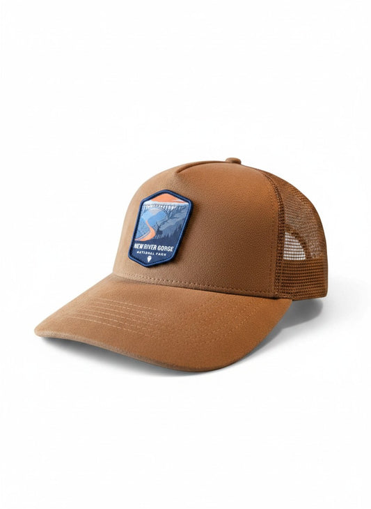 Moove Headwear New River Gorge National Park suede trucker hat with mesh back and adjustable snap closure.