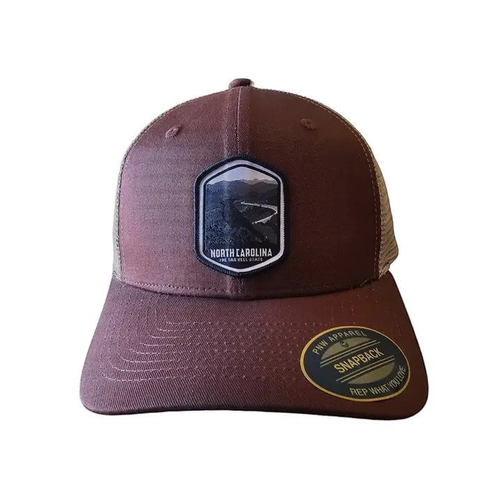 Moove Headwear North Carolina Tar Heels trucker hat with mesh back and embroidered landscape patch. Adjustable snapback.