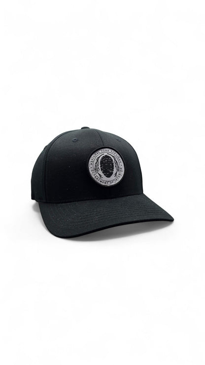 Moove Headwear black Flexfit hat with embroidered National Park Service logo patch on the front.