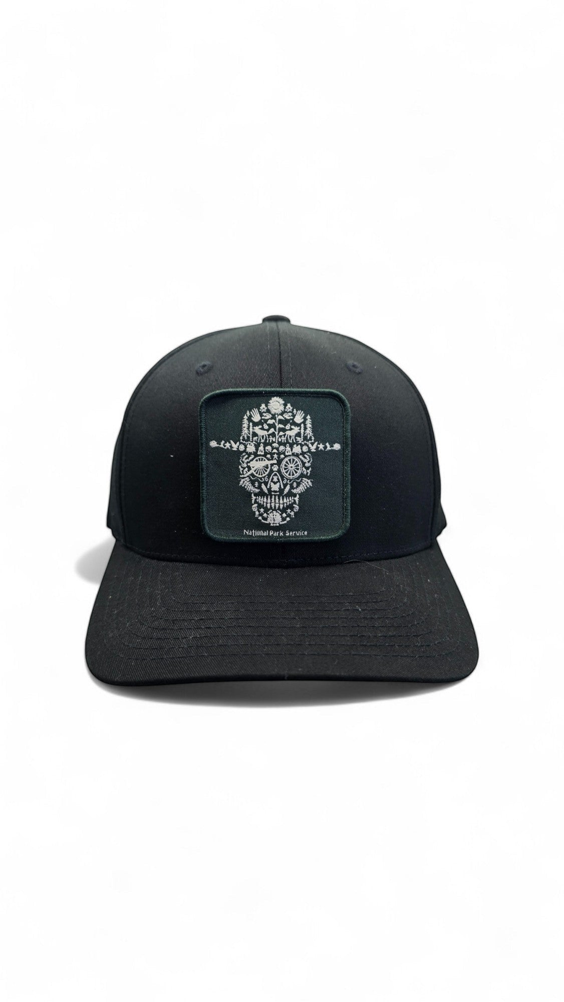 Moove Headwear black fitted National Park Service ranger hat with a square patch featuring a skull design made of nature elements.